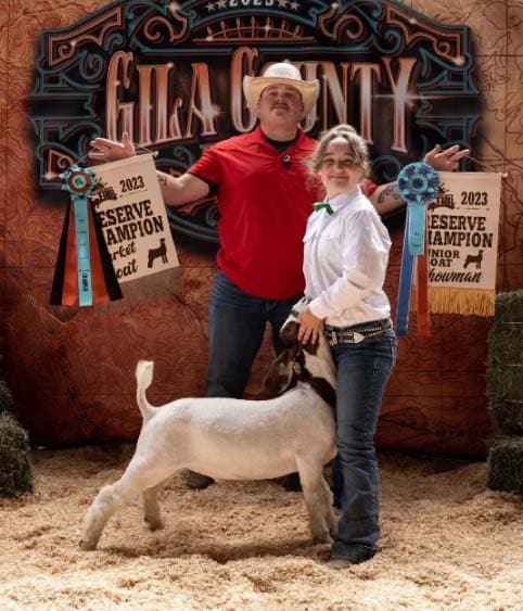 Lorelei with her dad and a goat