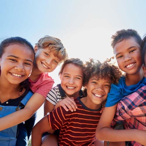 Diverse group of young students smiling at camera - Connections Academy