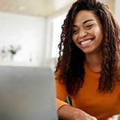 Student looking for college and career partnerships on their laptop