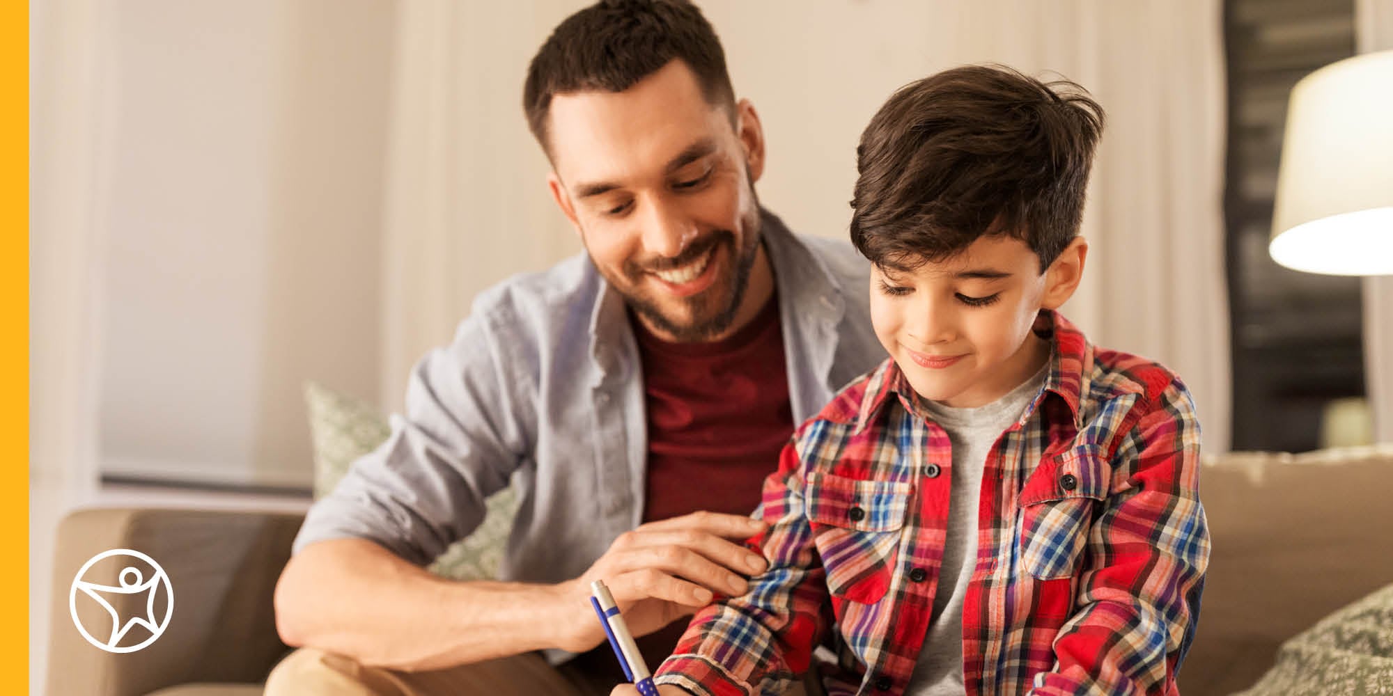 Dad and middle school boy at laptop